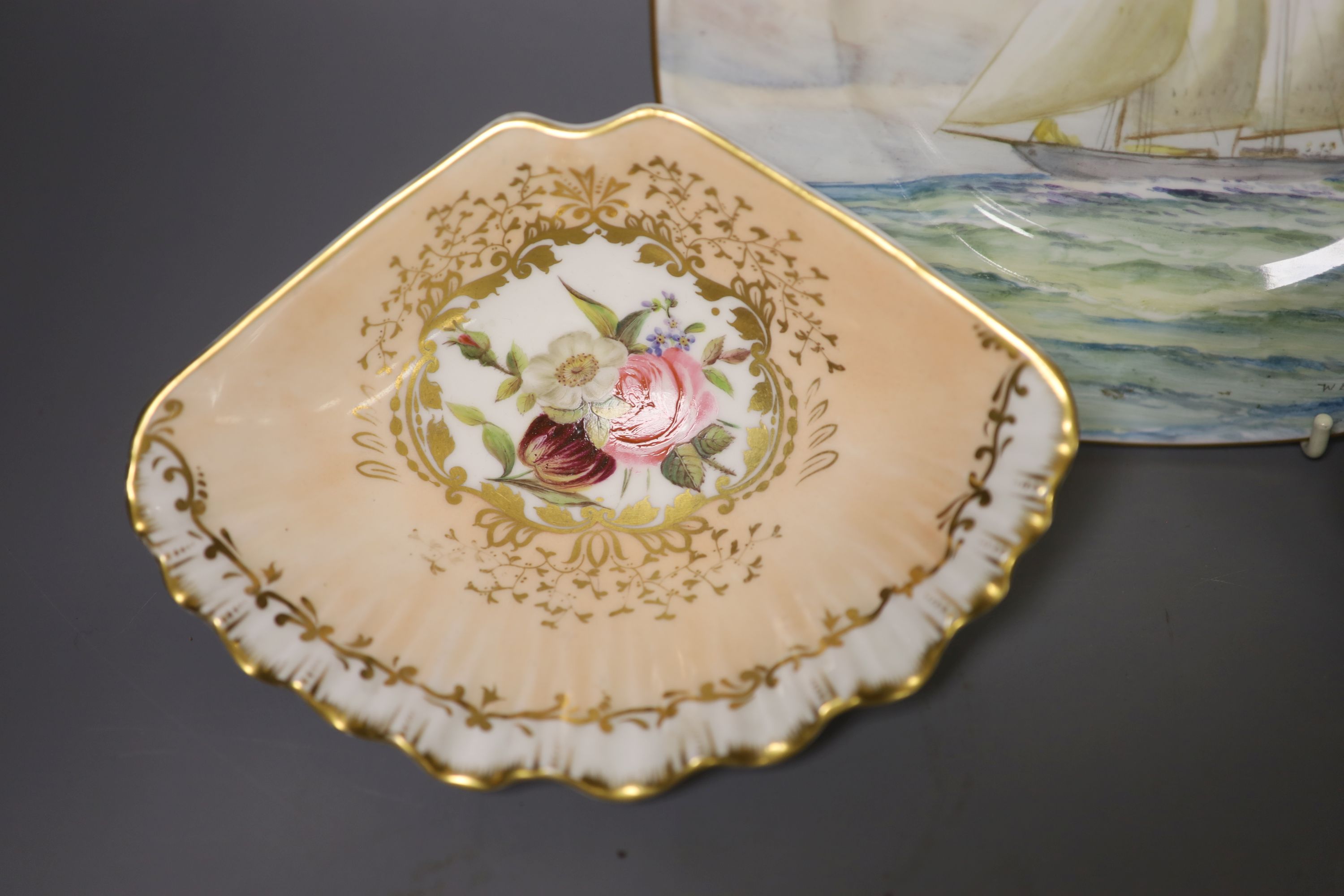 A Royal Crown Derby square shaped plate, painted with a yachting scene by WEJ Dean, and pair of Crown Derby scallop dishes